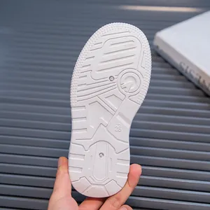 Detailed macro view of the durable white anti-slip rubber sole for children's sneakers