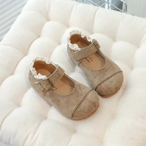 Retro tan suede children's Mary Jane shoes with delicate lace trim and soft sole