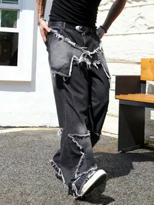Detail of men's high street denim jeans with star patchwork and distressed frayed edges