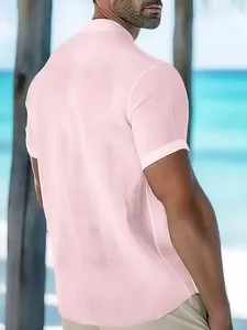 Back detail view of a men's light pink textured short-sleeve shirt with a stylish stand collar.