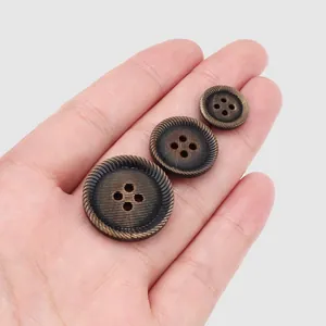Botones de cuerno marrón oscuro de alta gama con borde decorativo para abrigos