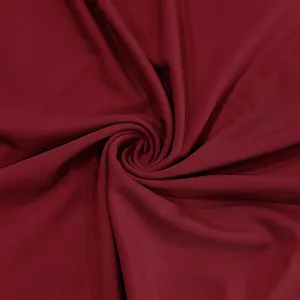 Macro view of high-quality deep red quick-dry breathable fabric texture for sports T-shirts