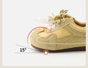 Close-up detail of vintage baby walking shoe featuring 15-degree ergonomic toe cap tilt for toddlers