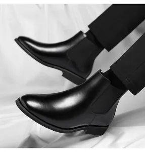 Side view of men's black leather Chelsea boots with classic elastic side panels