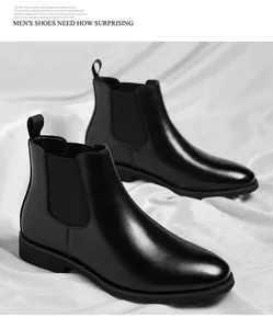 Classic black leather men's Chelsea boots displayed on elegant white satin fabric