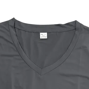 Close-up of V-neck collar on grey quick-dry polyester T-shirt with size tag