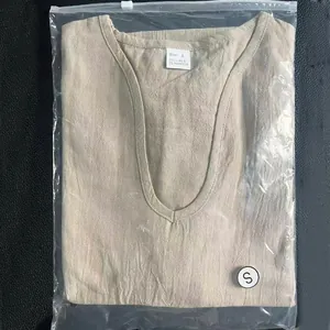 Detail view of a folded beige linen men's deep V-neck T-shirt in its plastic bag