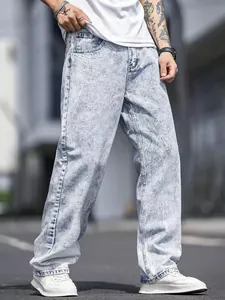 Detailed side profile view of men's light blue snow wash straight-leg denim jeans