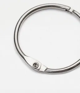 Detailed macro view of durable metal loose-leaf binder ring with a hollow rivet mechanism