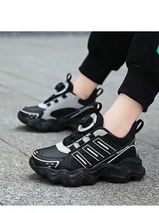 Detailed view of children's rotating buckle sneakers with breathable mesh material