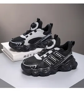 Modern black and grey mesh children's sneakers featuring a quick-lace rotary button