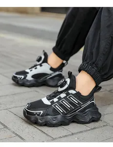 Outdoor street view of breathable children's running shoes with a rotary buckle system
