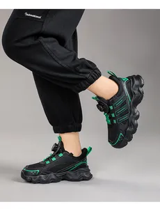 Detailed view of children's breathable mesh running shoes with rotating buckle closure
