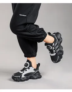 Close-up of breathable mesh children's sneakers with rotating buckle and anti-slip sole