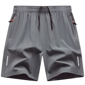 Herren Schnelltrocknende Sporthose in Grau mit Reflektorstreifen und Reißverschlusstaschen