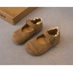 High-quality close-up of brown suede Mary Jane shoes for girls with lace trim and buckle