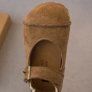 Classic brown suede Mary Jane toddler shoes featuring adjustable buckle strap detail