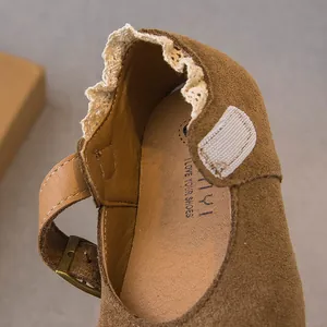 Toddler girl's brown suede Mary Jane shoes with delicate lace trim and velcro strap
