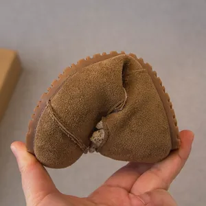 Flexible brown suede toddler loafers with soft rubber sole for girls' casual wear.