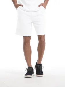 Detail of men's white waffle knit sports shorts in a comfortable casual summer set