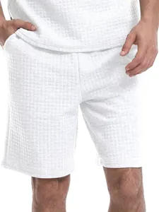 Detailed view of men's white waffle knit casual shorts featuring a loose sport fit design