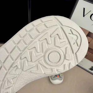 Detailed macro view of white non-slip rubber outsole for children's sports shoes