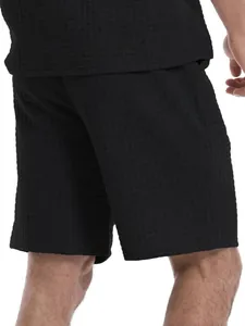Close-up of black waffle knit texture on men's casual summer sports shorts set