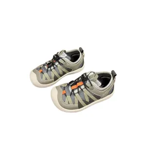 Breathable mesh kids sneakers with quick-tie toggle laces in olive grey and white colors