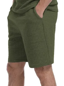 Detailed view of men's olive green waffle knit shorts set showing grid fabric texture