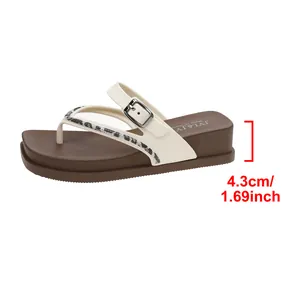 Detail of comfortable wedge flip-flop with 4.3cm heel height measurement