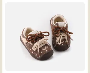 Detailed close-up of brown baby walking shoes featuring polka dots and mesh breathable fabric