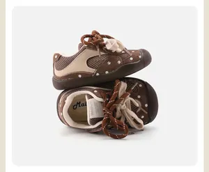 Close-up of brown polka dot baby walking shoes with breathable mesh and anti-slip sole