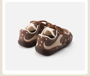 Rear view of brown polka dot infant walking shoes with breathable mesh and anti-slip soles