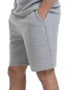Close-up of men's gray waffle texture casual shorts with side pockets