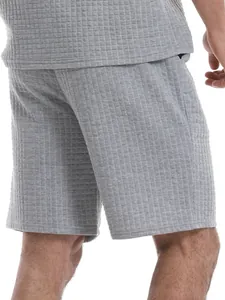 Close-up detail of gray waffle-textured fabric on men's casual shorts set