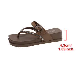 Close-up detail of a brown platform flip-flop showing the 4.3cm heel height measurement