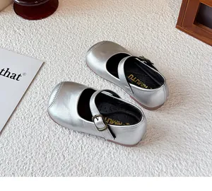Detail view of silver metallic children's leather shoes with square toe design