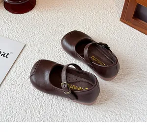 Detailed view of brown British-style Mary Jane shoes for girls with soft soles.