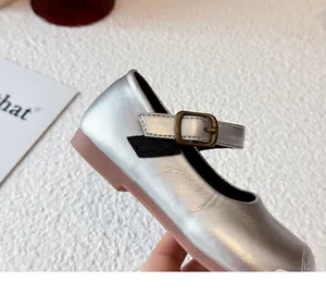Close-up of silver metallic Mary Jane princess shoes for girls with an adjustable buckle strap