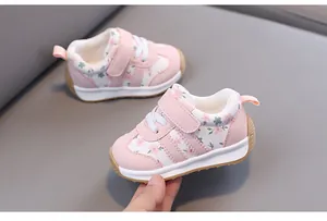 Close-up of pink floral baby walking shoes with soft non-slip sole and hook-and-loop strap