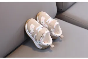 Macro detail of toddler floral walking shoes featuring soft leather and secure strap