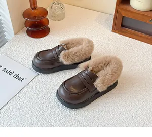 Close-up of children's warm leather loafers with soft plush lining and non-slip sole