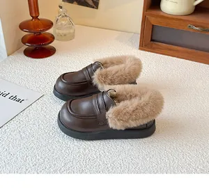 Winter children's faux leather loafers with plush fur trim and soft soles in brown color