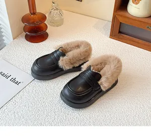 Classic black children's loafers with warm faux fur lining for winter season