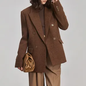 High-end Japanese brass buttons shown on a classic brown tweed double-breasted blazer