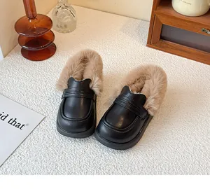 Detail shot of kids winter warm leather loafers with soft fur lining and slip-on design