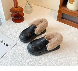 Detail view of children's black leather shoes highlighting the thick warm plush lining