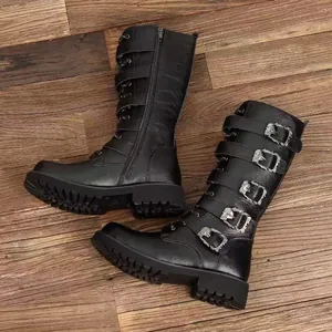 Detailed side view of black tall leather work boots with multiple buckled straps