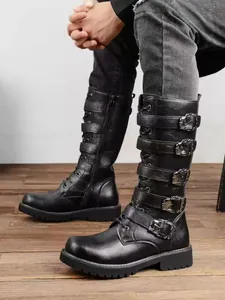 Side view of black men's knee-high punk boots with five adjustable metal buckles