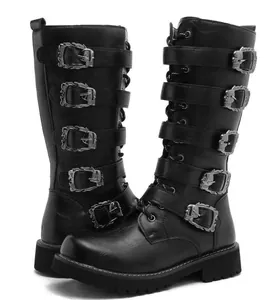 Detailed side view of men's black gothic tall leather boots with ornate skull buckles